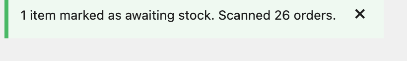 A green success notice reading: 1 item marked as awaiting stock. Scanned 26 orders.